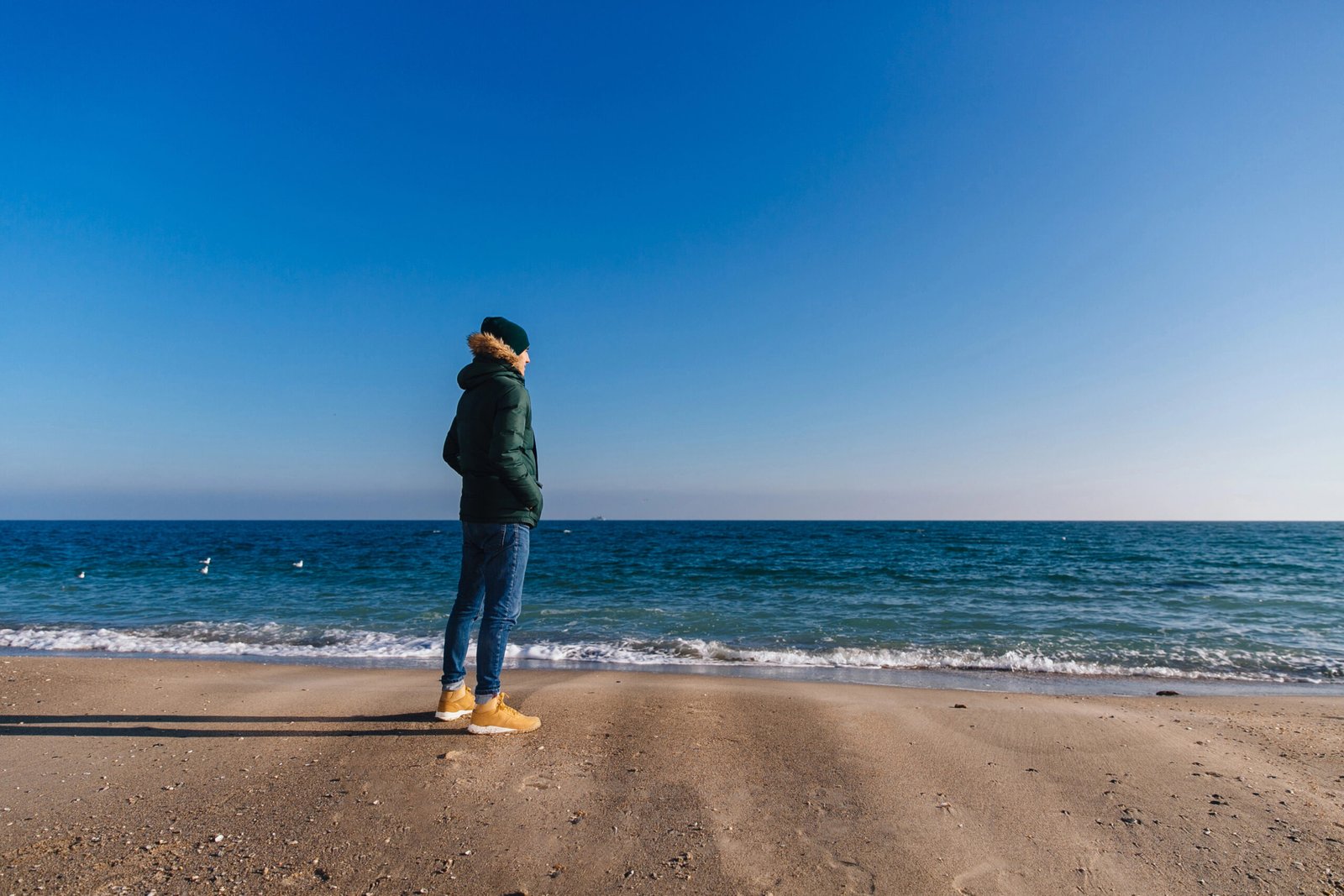man looking at the sea